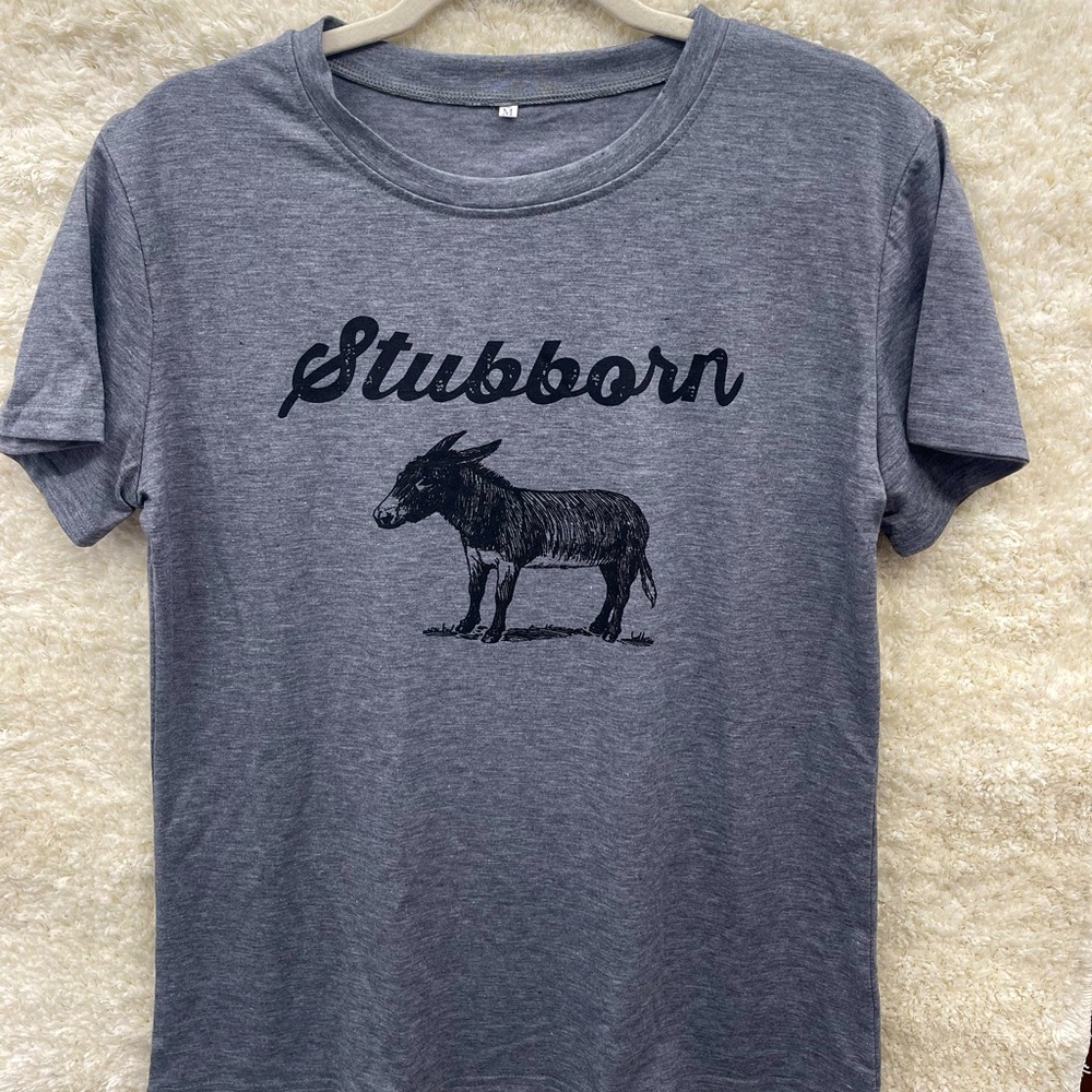 Stubborn Ass Tshirt in a nice grey. Very soft material and nwt. 😂 sizes L & XL